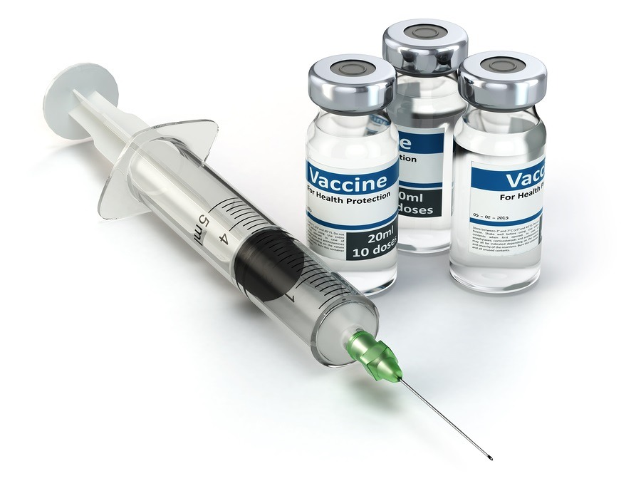 Vaccine in vial with syringe.