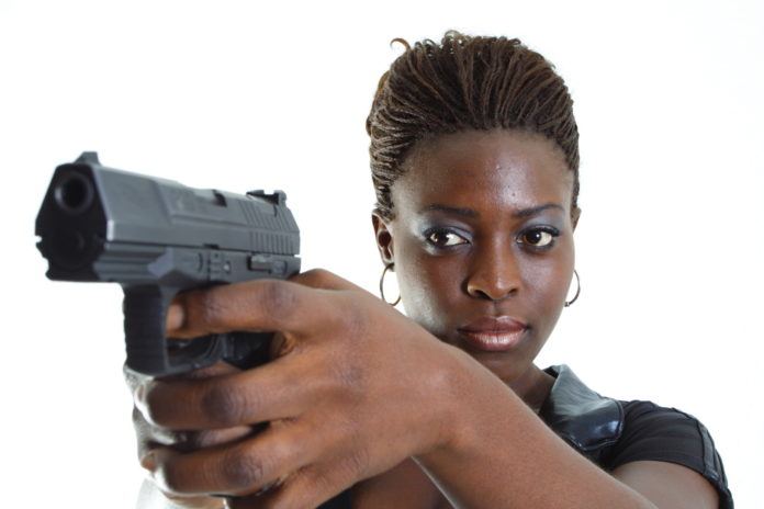 Black woman with hand gun | 76,253 dead 6,033,218 injured recorded in europe and usa following covid vaccines with 4,358 fetal deaths in u.s. | health
