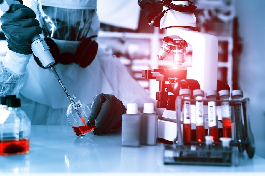 Laboratory examination of Ebola. Scientist takes blood pipette a