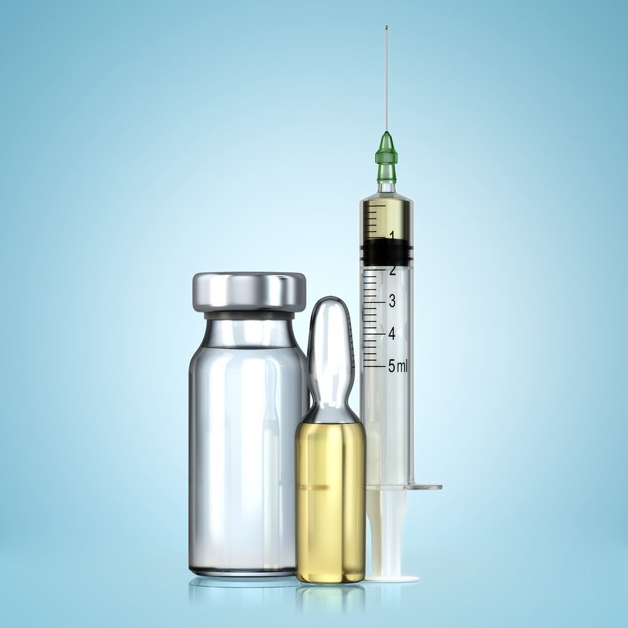 Vaccine in vial with syringe.