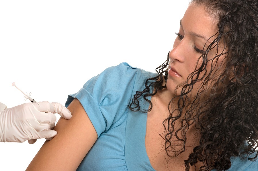 Flu or gardasil vaccine on white background