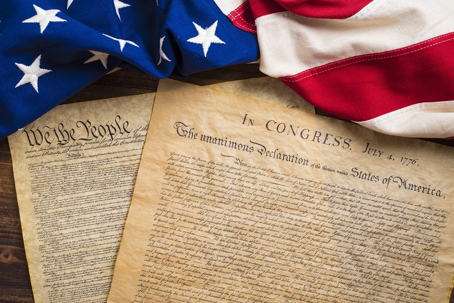 The Declaration of Independence and Constitution of the United States of America with a vintage flag