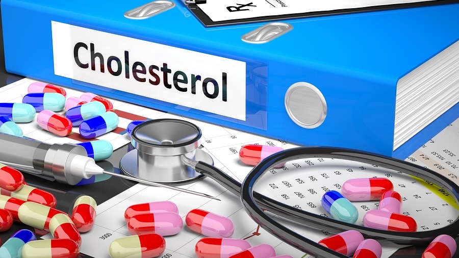 Illustration of doctor's desktop with different pills, capsules, statoscope, syringe, blue folder with label 'Cholesterol'